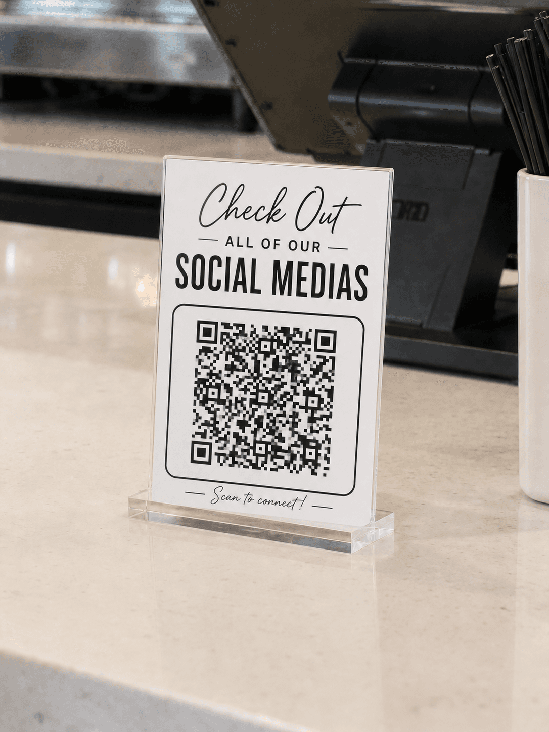 All Socials QR Display on a checkout counter