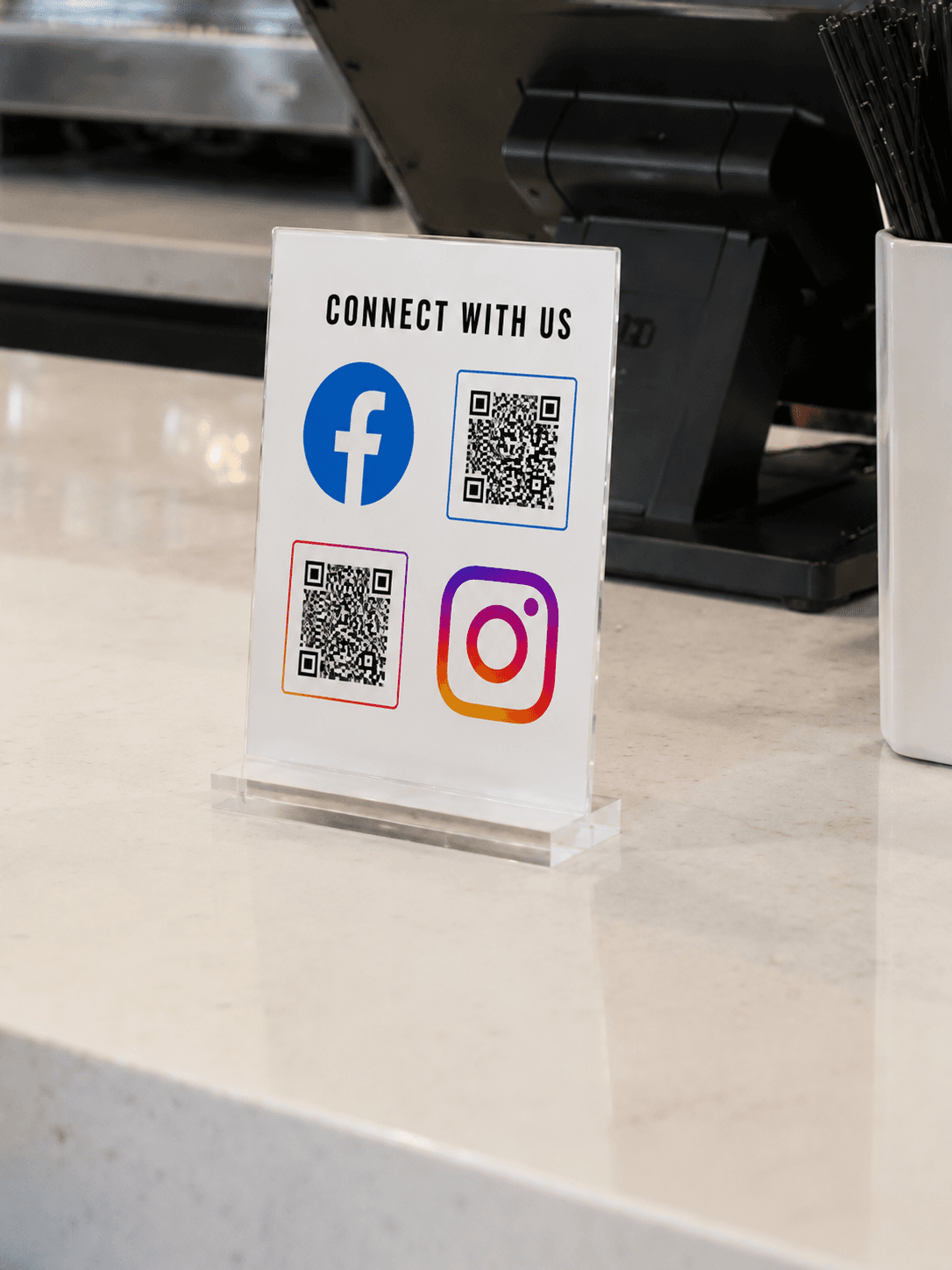 Facebook and Instagram QR Display on a checkout counter